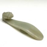 A Chinese jade belt hook, late Qing/Republic period, the plain shaft with bulbous-eyed dragon head