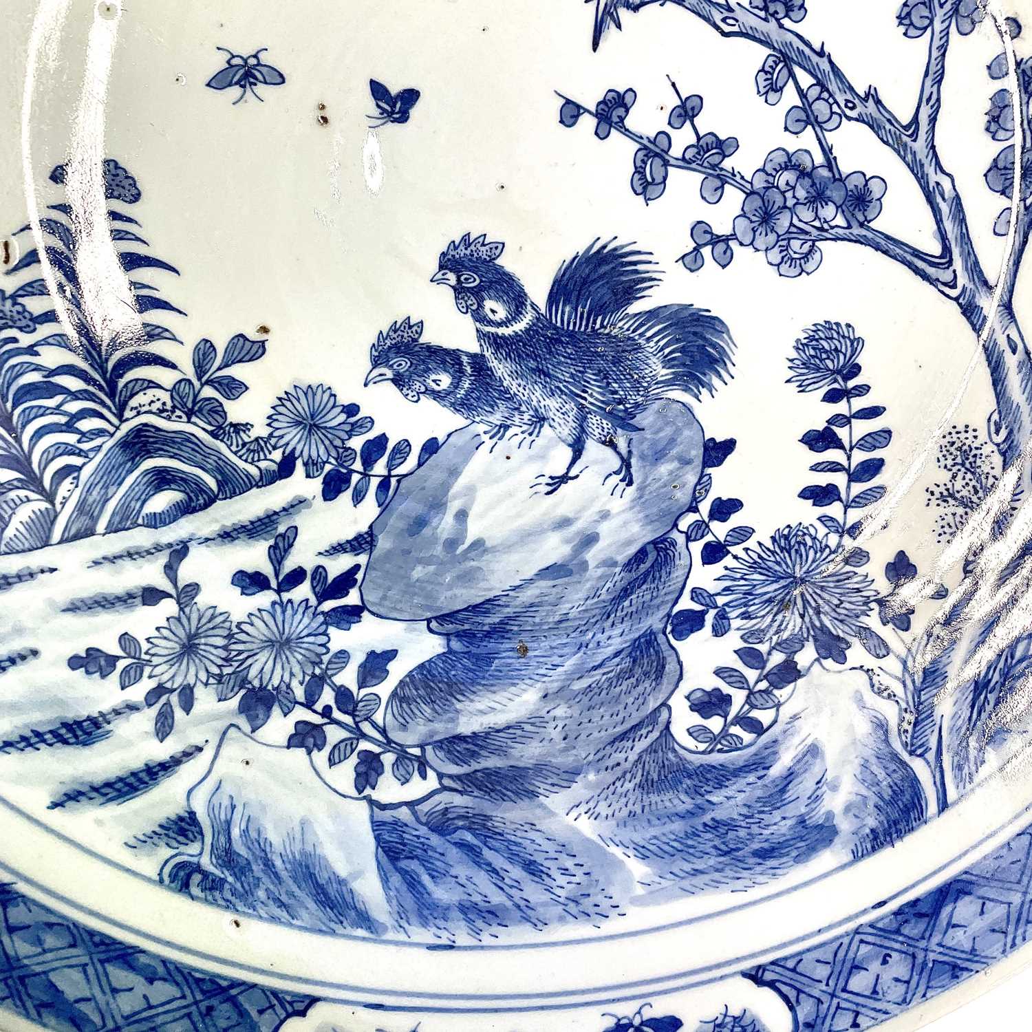 A Chinese blue and white porcelain charger, 19th century, with birds perched on a blossoming tree - Image 7 of 17