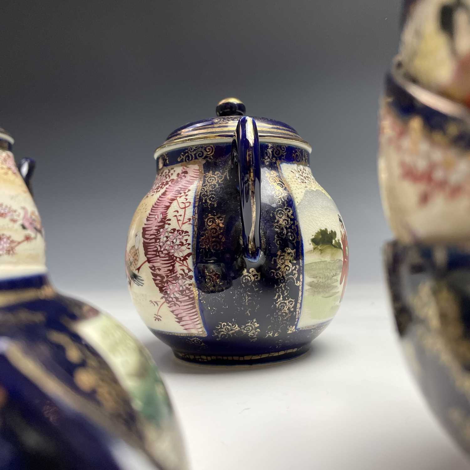 A Japanese satsuma tea service, early 20th century, comprising a teapot, hot water jug, sugar - Image 10 of 18