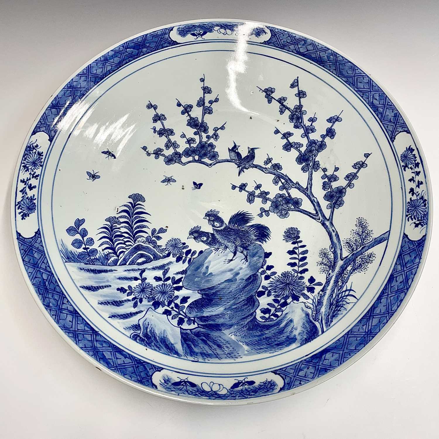 A Chinese blue and white porcelain charger, 19th century, with birds perched on a blossoming tree - Image 6 of 17