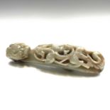 A Chinese jade belt hook, Qing Dynasty, carved with a scroll form chilong facing a dragon head