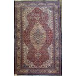 A Tabriz rug, North West Persia, mid 20th century, the red field with a lobel medallion, with the