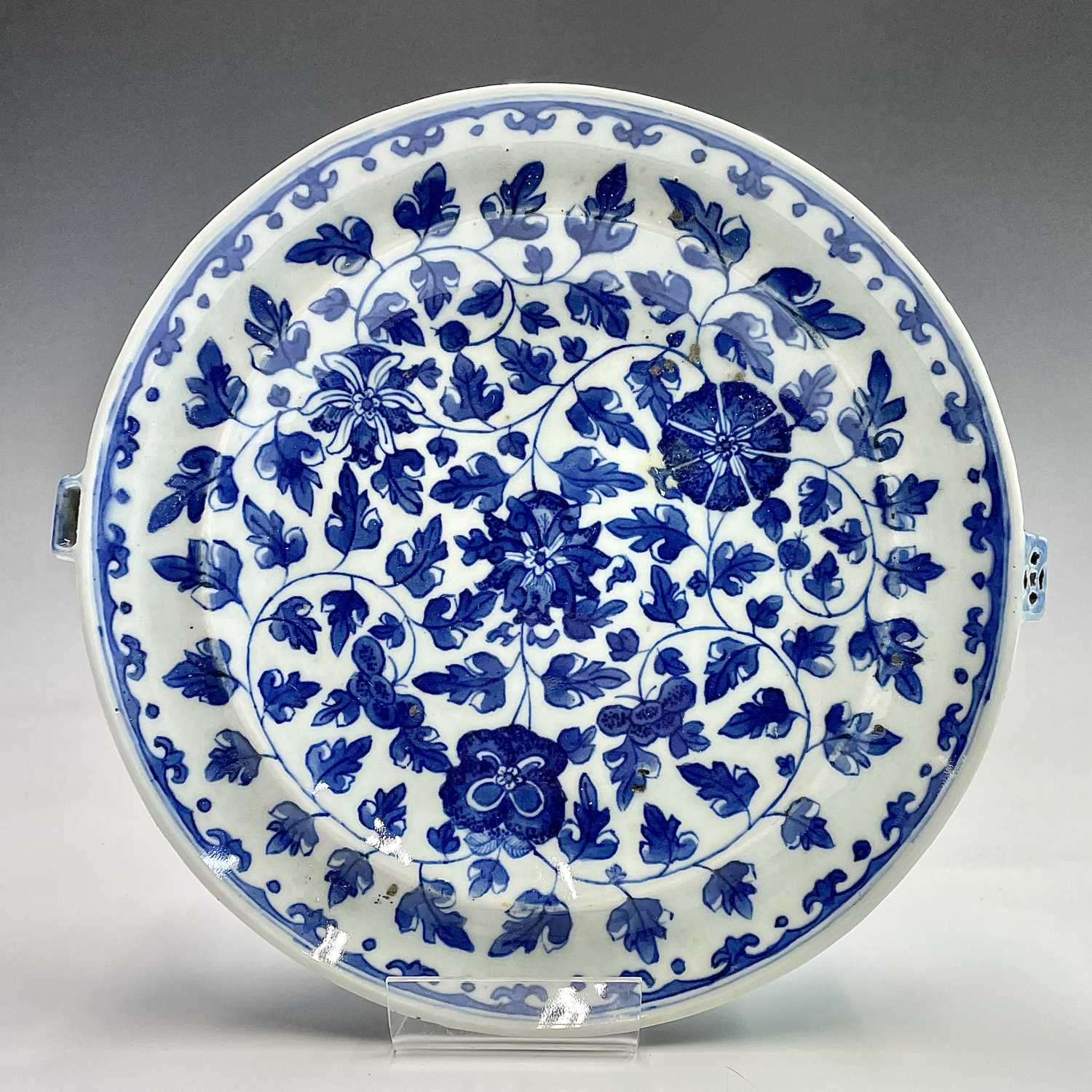 A Chinese export porcelain blue and white warming plate, late 18th century, with an all over