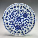 A Chinese export porcelain blue and white warming plate, late 18th century, with an all over