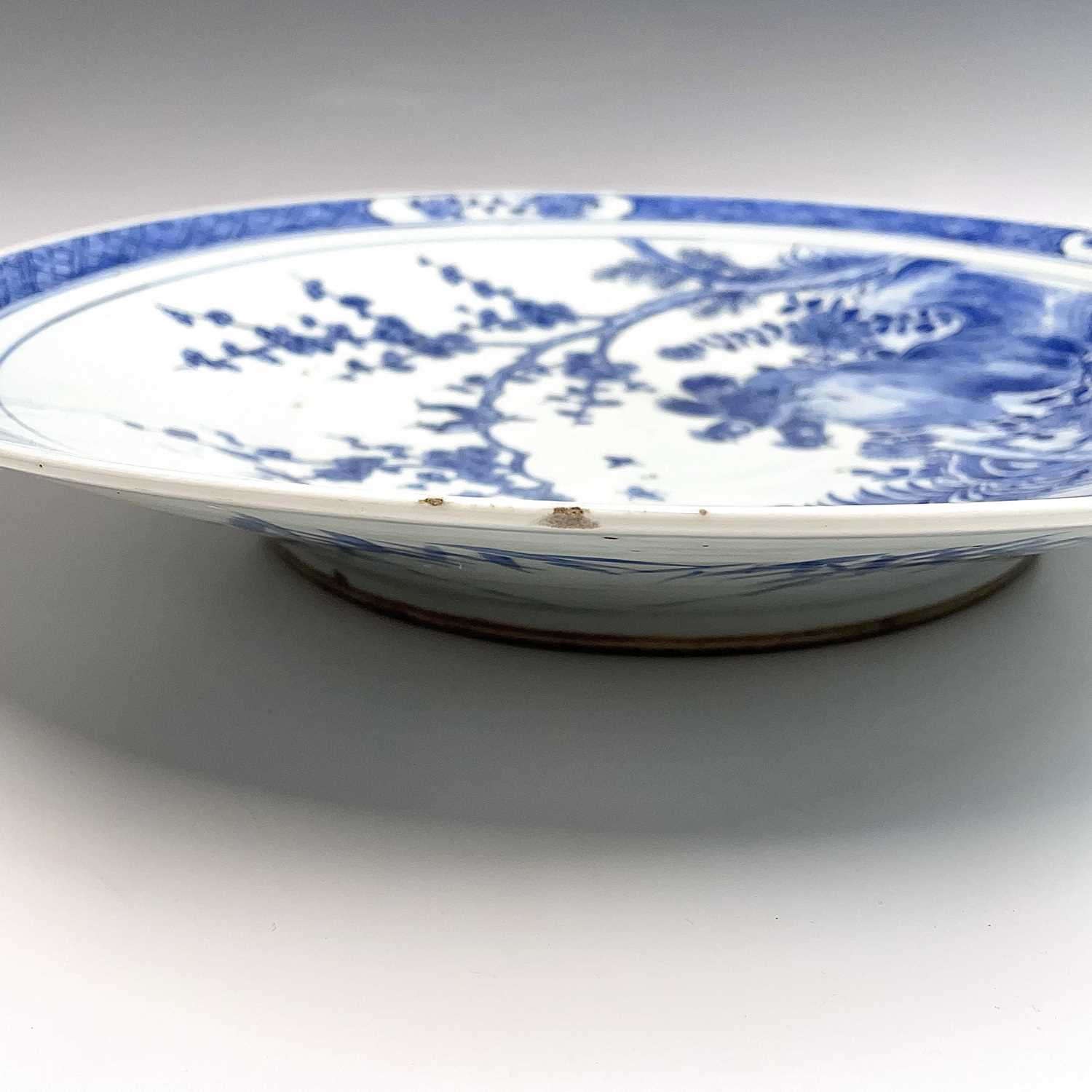 A Chinese blue and white porcelain charger, 19th century, with birds perched on a blossoming tree - Image 8 of 17