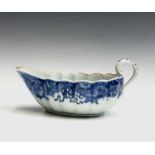 A Chinese Export porcelain sauce boat, 18th century, the interior with birds, a tree and flowers