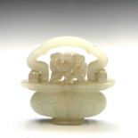 A Chinese jade-type pendant in the form of a basket of flowers, mid 20th century, with swing handle,