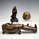 An Indian carved wood model of a rhino, early 20th century, height 8cm, length 28cm, a Chinese