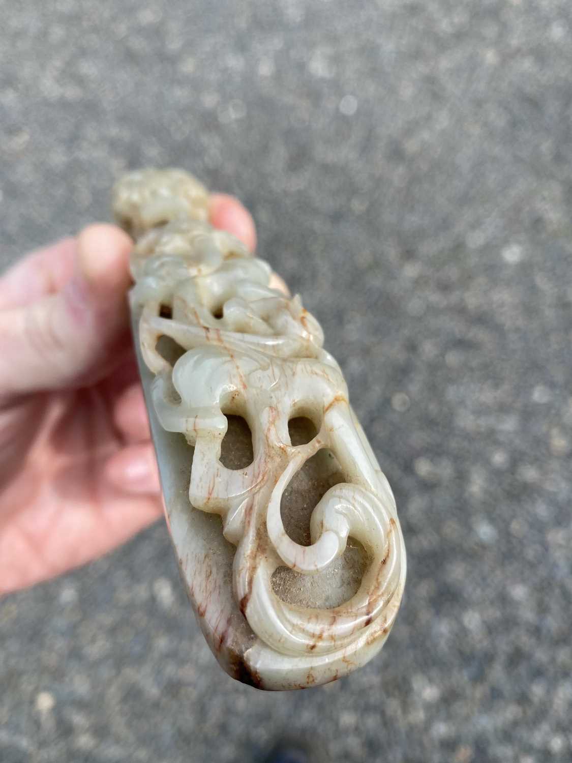 A Chinese jade belt hook, Qing Dynasty, carved with a scroll form chilong facing a dragon head - Image 22 of 33