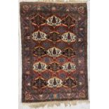 A Baktihari rug, North West Persia, circa 1900-1920, the madder field with five rows of three