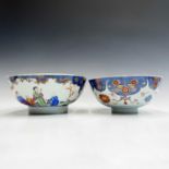 A Chinese famille rose porcelain bowl, circa 1800, the blue and white interior with a central floral