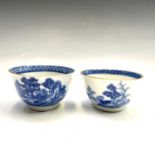 A pair of Chinese blue and white porcelain tea bowls, 18th century, heights 4.5cm and 4.2cm,