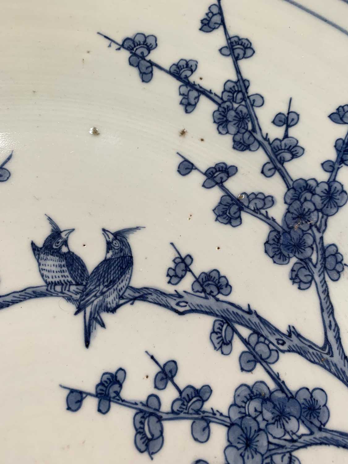 A Chinese blue and white porcelain charger, 19th century, with birds perched on a blossoming tree - Image 9 of 17