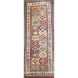 A Genje long rug, South East Caucasus, late 19th century, the sectioned field with twelve rows of