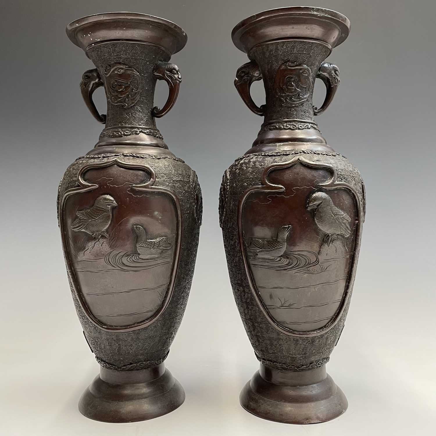 A pair of Japanese bronze twin-handled vases, Meiji period, seal mark, relief decorated with - Image 7 of 12