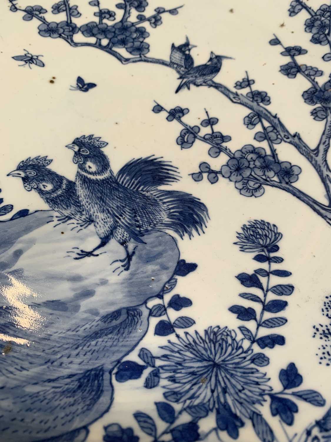 A Chinese blue and white porcelain charger, 19th century, with birds perched on a blossoming tree - Image 11 of 17