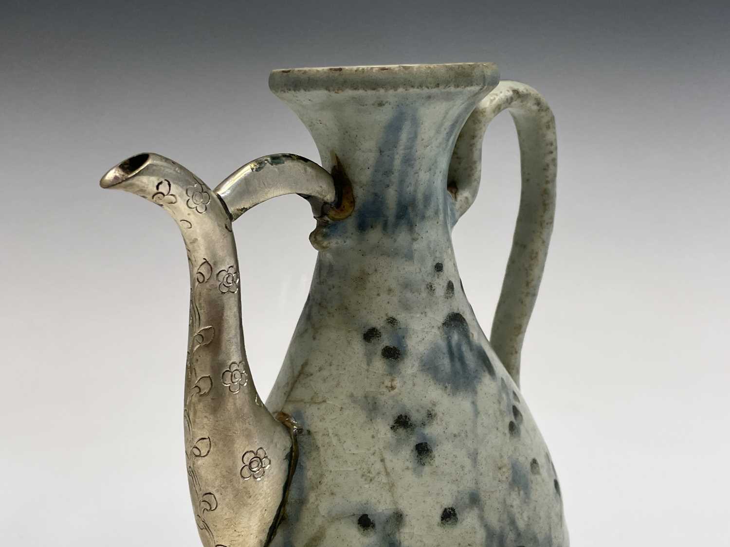 A Chinese blue and white ewer, Ming Dynasty, with white metal spout, height 18.5cm, width 14cm. - Image 5 of 7