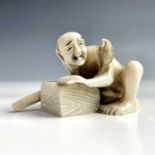 A Japanese ivory netsuke of a rat catcher, Meiji period, signed, with a rat on his shoulder,