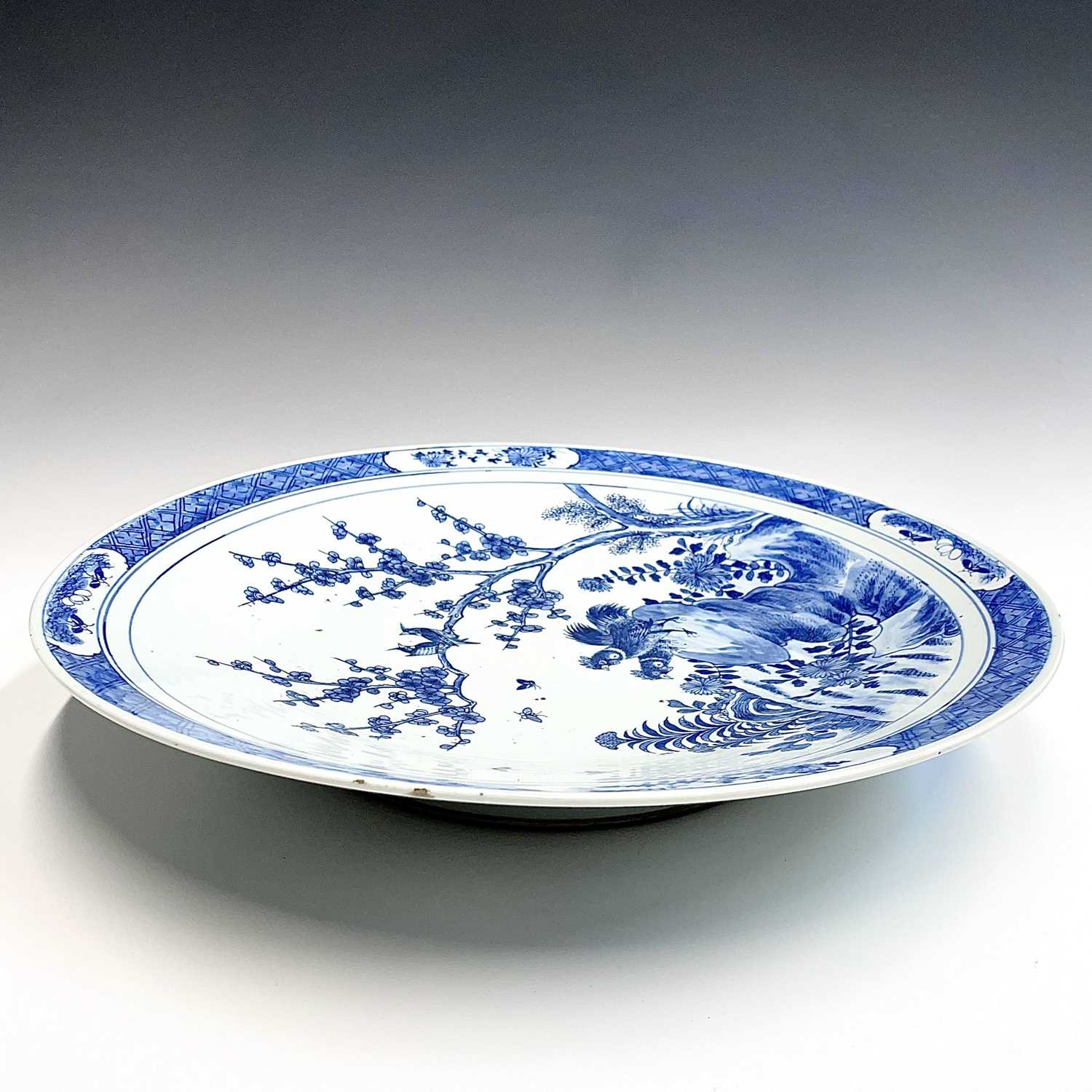 A Chinese blue and white porcelain charger, 19th century, with birds perched on a blossoming tree - Image 4 of 17