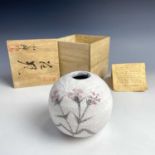 A Japanese painted pottery globular vase, mid 20th century, the white ground with three stylised