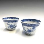 A pair of Chinese blue and white porcelain tea bowls, 18th century, each with quail amongst foliage,
