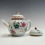 A Chinese famille rose porcelain teapot, 18th century, decorated with plants and foliage, height