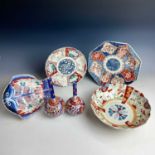 Six Japanese Imari porcelain items, 19th century, to include two bud vases, plates and bowls.