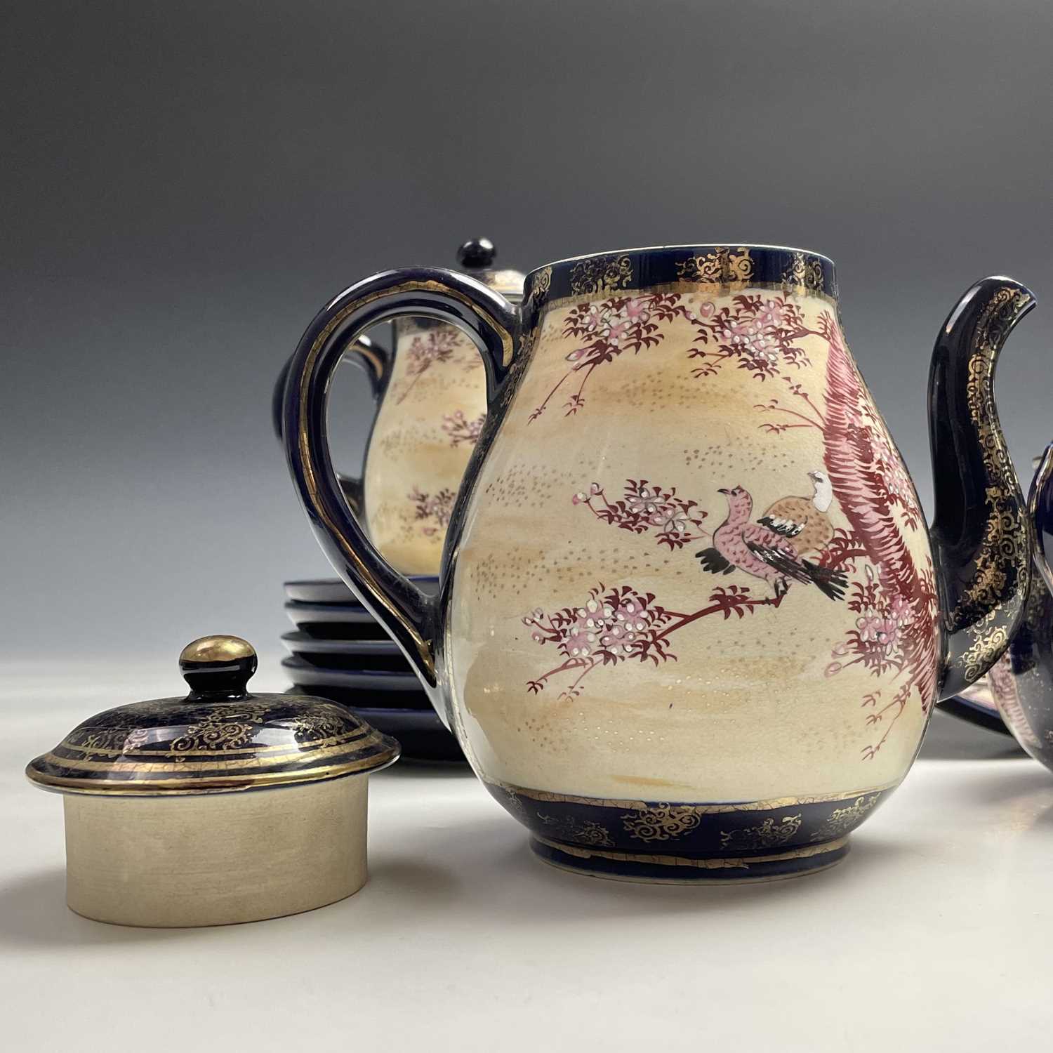 A Japanese satsuma tea service, early 20th century, comprising a teapot, hot water jug, sugar - Image 2 of 18