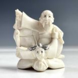 A Japanese ivory netsuke group, early 20th century, signed, height 5.5cm, width 5cm.