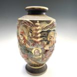 A Japanese Satsuma pottery vase, circa 1920's, decorated on relief with figures and trees in a
