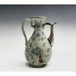 A Chinese blue and white ewer, Ming Dynasty, with white metal spout, height 18.5cm, width 14cm.