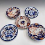 A pair of Chinese porcelain plates, late 18th century, diameter 22cm, a pair of Japanese imari