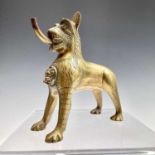 An Indian polished bronze aquamanile, 19th century, in the form of a stylised lion, with water spout