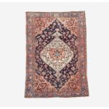 A Malayer rug, North West Persia, circa 1900, the indigo field with a large ivory medallion,