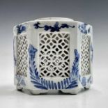 A Chinese blue and white porcelain hexagonal inkwell, circa 1900, the side with reticulated