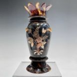 A Japanese tortoisehell vase, circa 1900, the body applied with gold foliate decoration, height