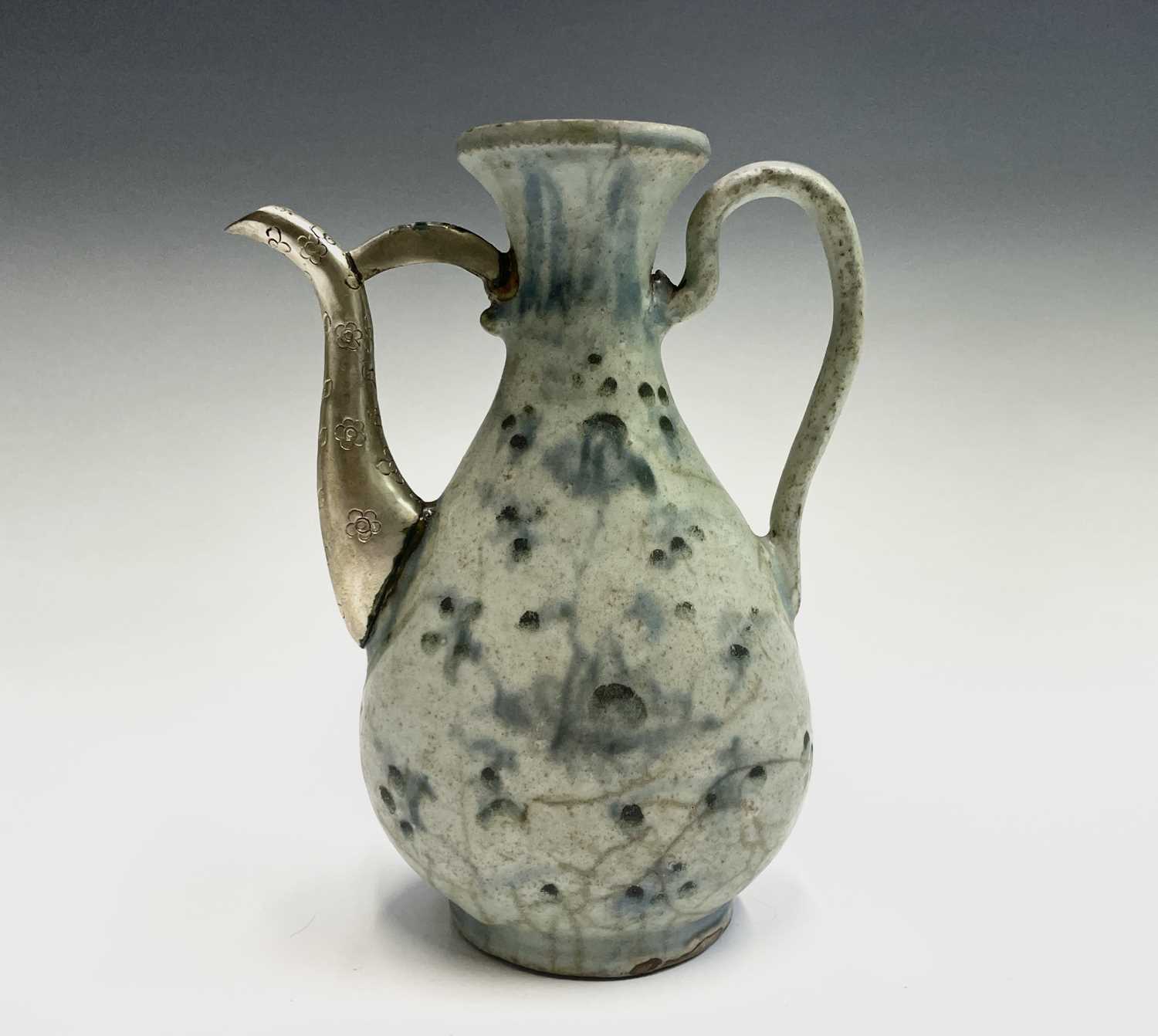 A Chinese blue and white ewer, Ming Dynasty, with white metal spout, height 18.5cm, width 14cm. - Image 2 of 7