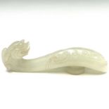 A Chinese jade belt hook, mid 20th century, of typical form, with a dragon's head and scroll