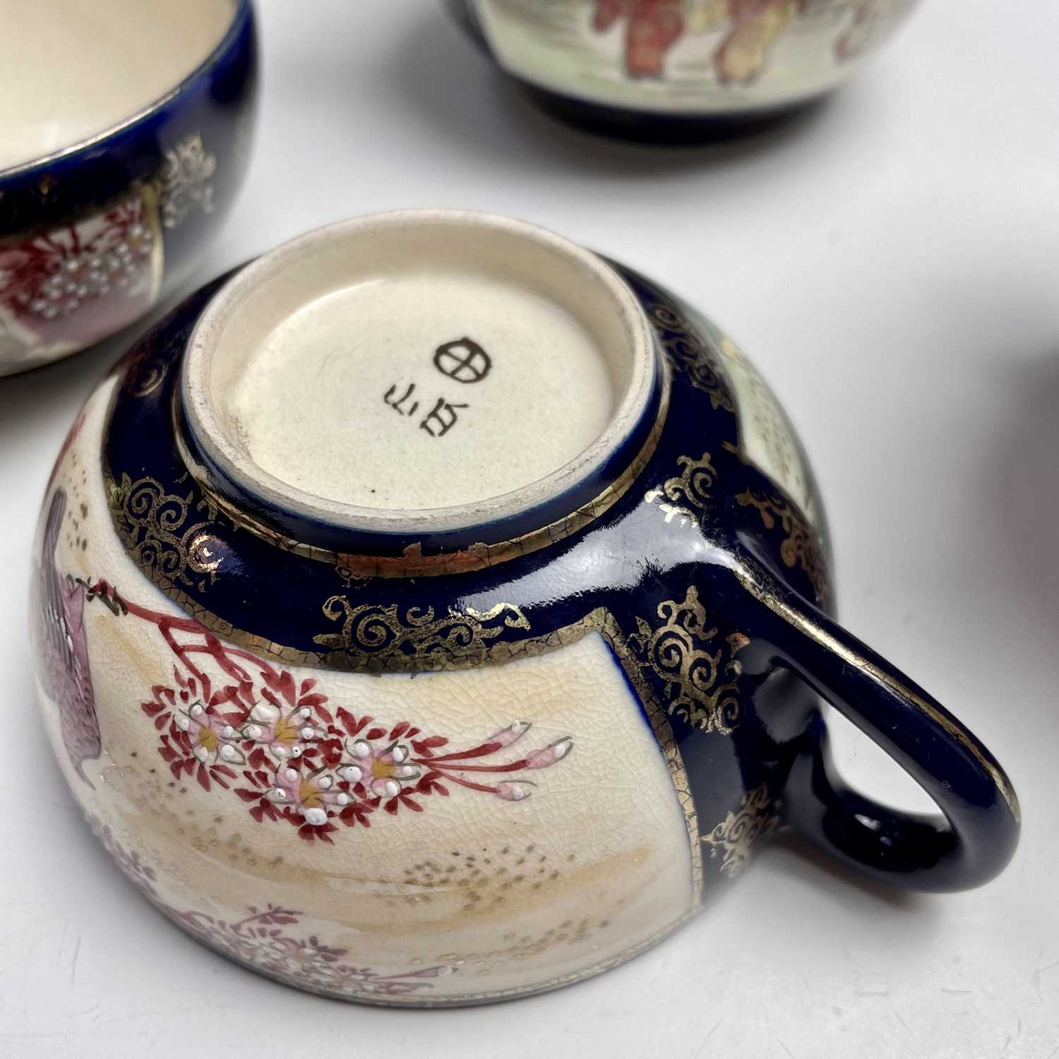 A Japanese satsuma tea service, early 20th century, comprising a teapot, hot water jug, sugar - Image 14 of 18