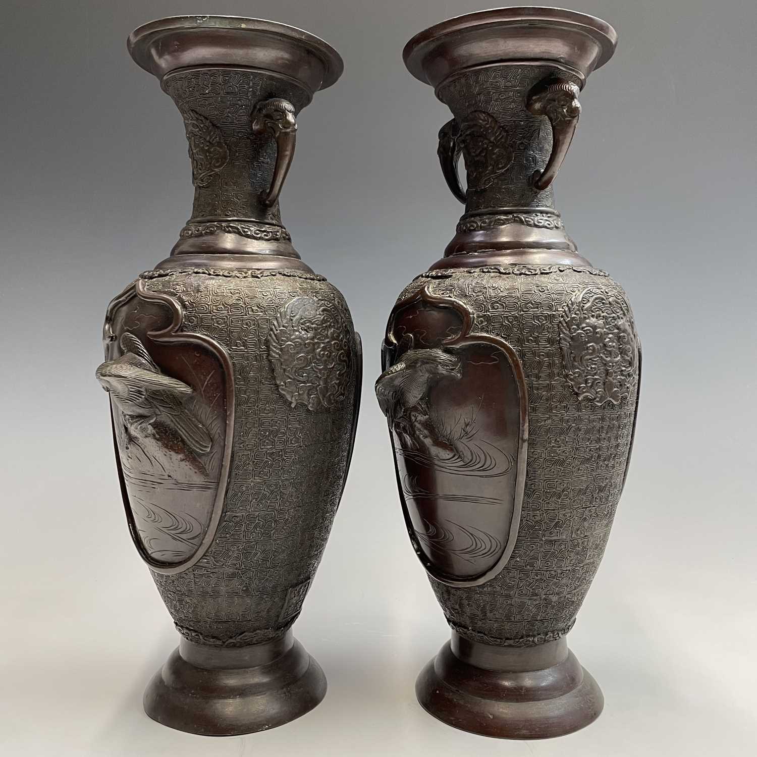 A pair of Japanese bronze twin-handled vases, Meiji period, seal mark, relief decorated with - Image 10 of 12