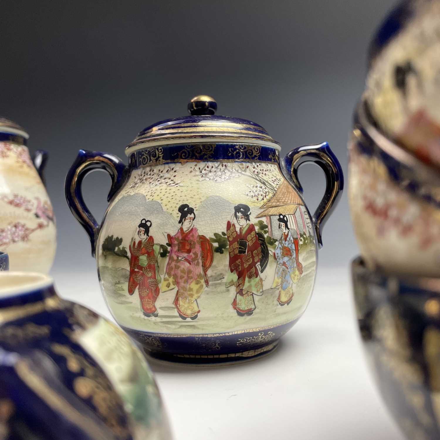 A Japanese satsuma tea service, early 20th century, comprising a teapot, hot water jug, sugar - Image 16 of 18