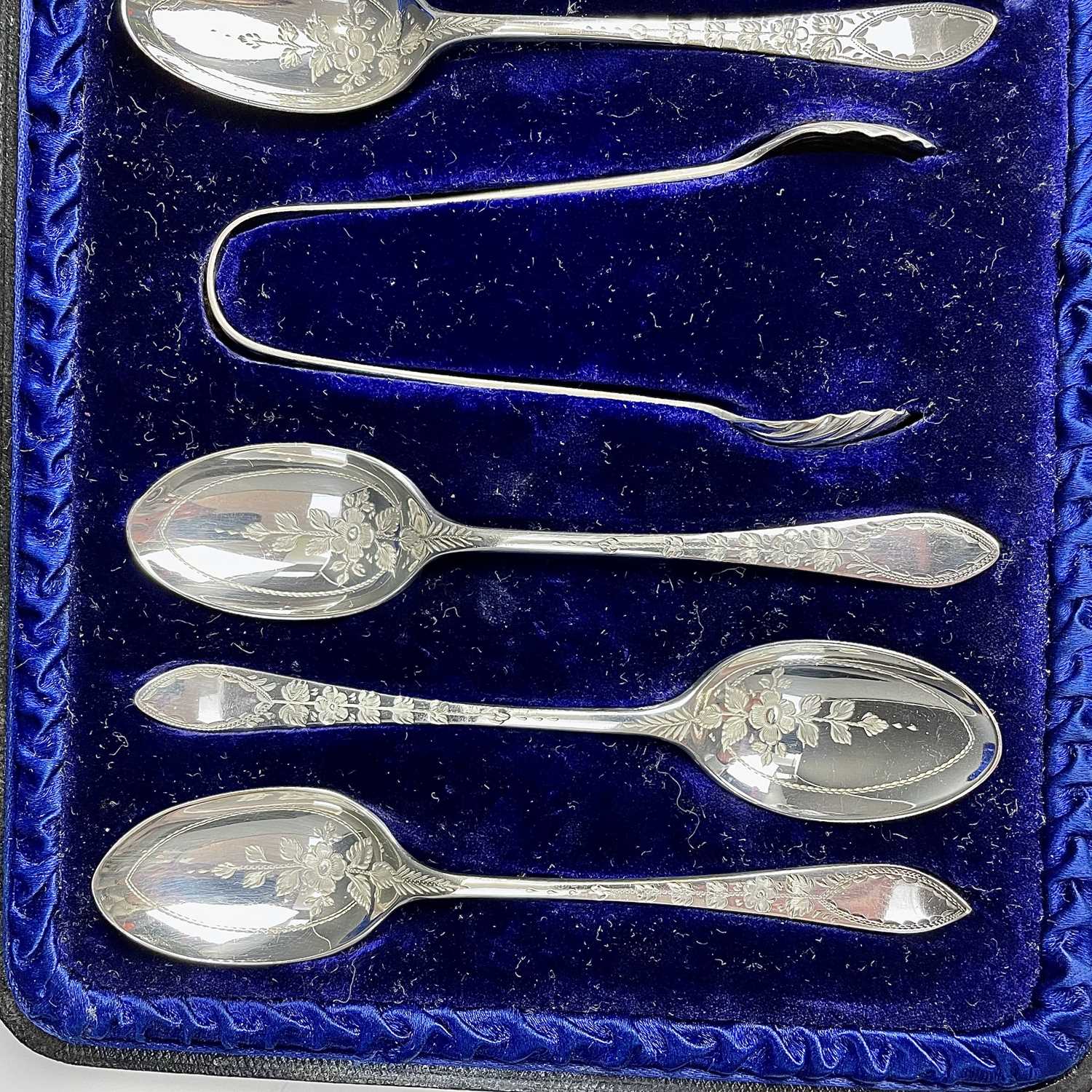 A Victorian cased set of six silver teaspoons and tongs with floral chased decoration by Atkins - Image 6 of 8