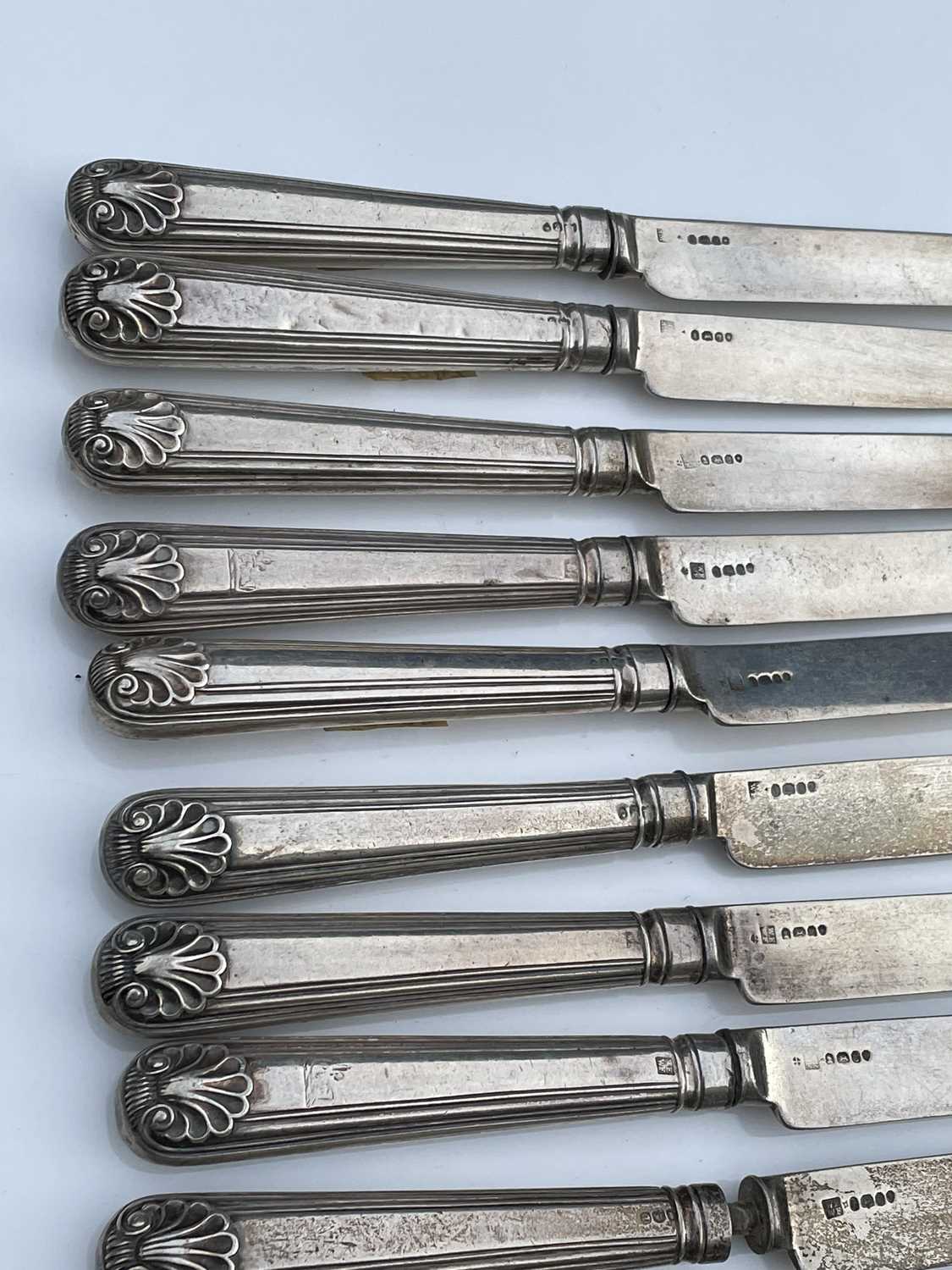 A George IV set of twelve shell and thread pattern dessert knives, with filled handles and silver - Image 8 of 8
