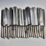 A George III and later harlequin set of 24 dinner knives with steel blades and silver filled