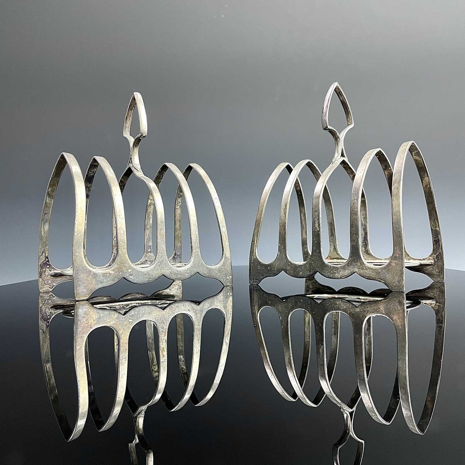 A pair of George V silver four section toast racks by William Hutton & Sons, Sheffield 1917, width