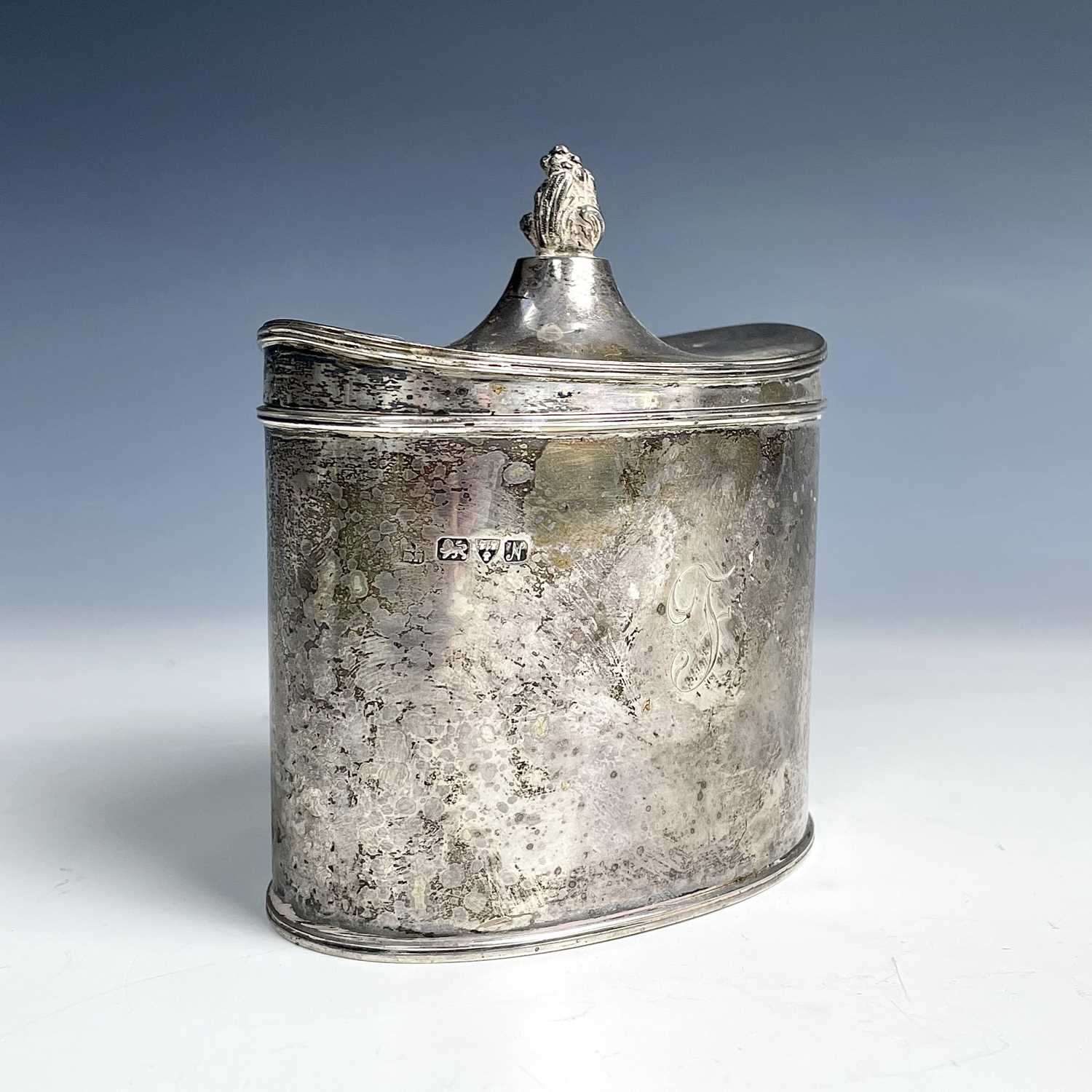 A George V silver George III style oval section tea caddy by George Nathan & Ridley Hayes, the