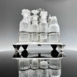 A George III silver seven bottle cruet frame by Crispin Fuller, of rectangular section and with cast