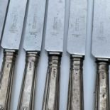 A harlequin set of twelve George IV and early Victorian Kings Pattern table knives with filled