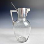 A Victorian Arts & Crafts silver and glass claret jug by Mappin & Webb, with hinged lid and silver