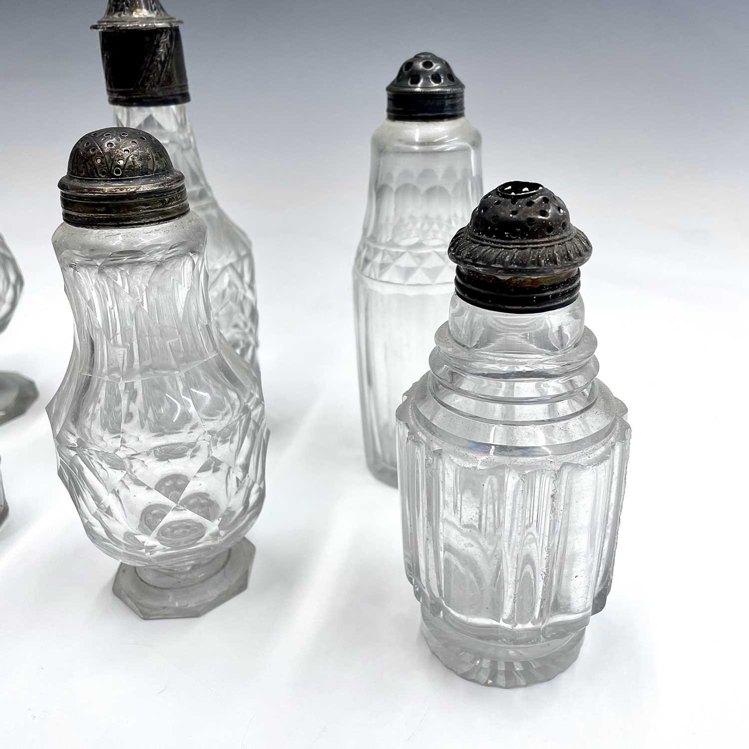 A collection of eight Georgian facet and cut glass cruet bottles with silver lids, all unmarked, the - Image 4 of 7